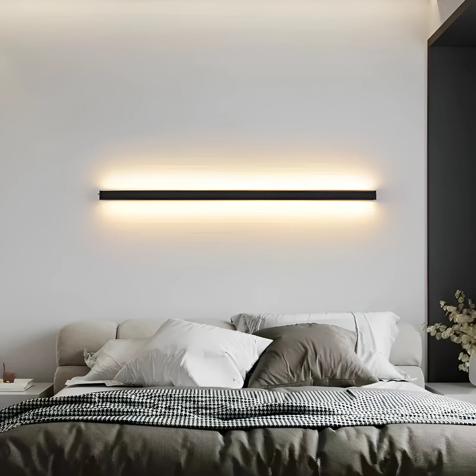 80cm black aluminium LED strip wall lamp with touch control panel on a modern interior wall.