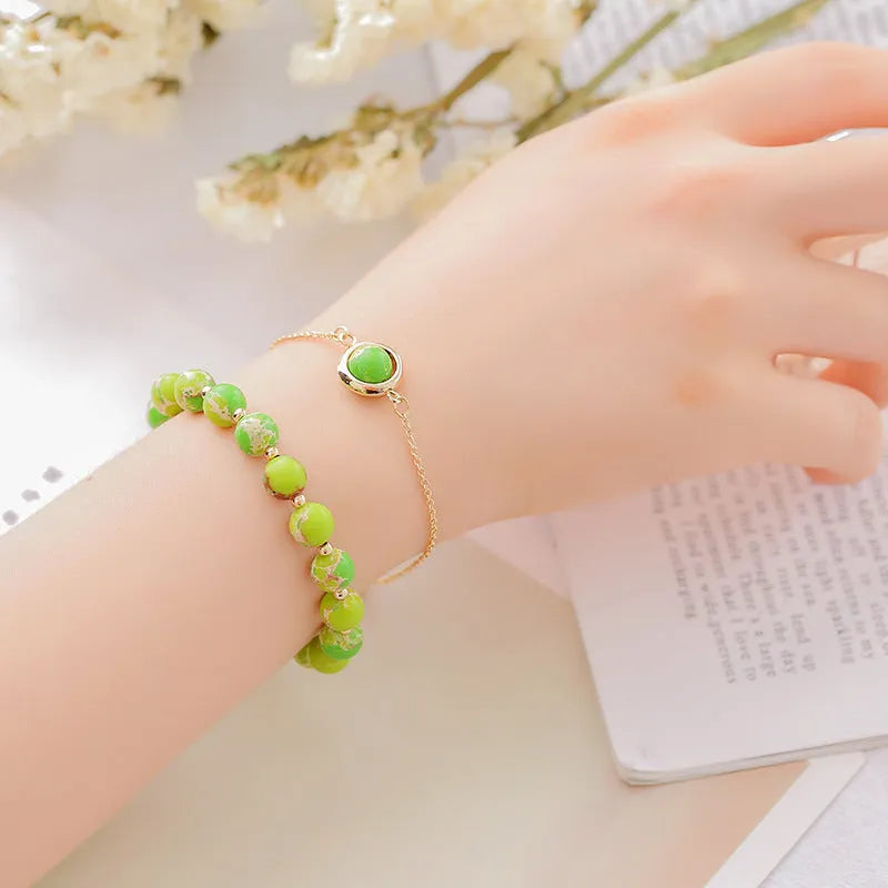 Double-layer women's bracelet with crystal beads and lucky charms in gold electroplated finish