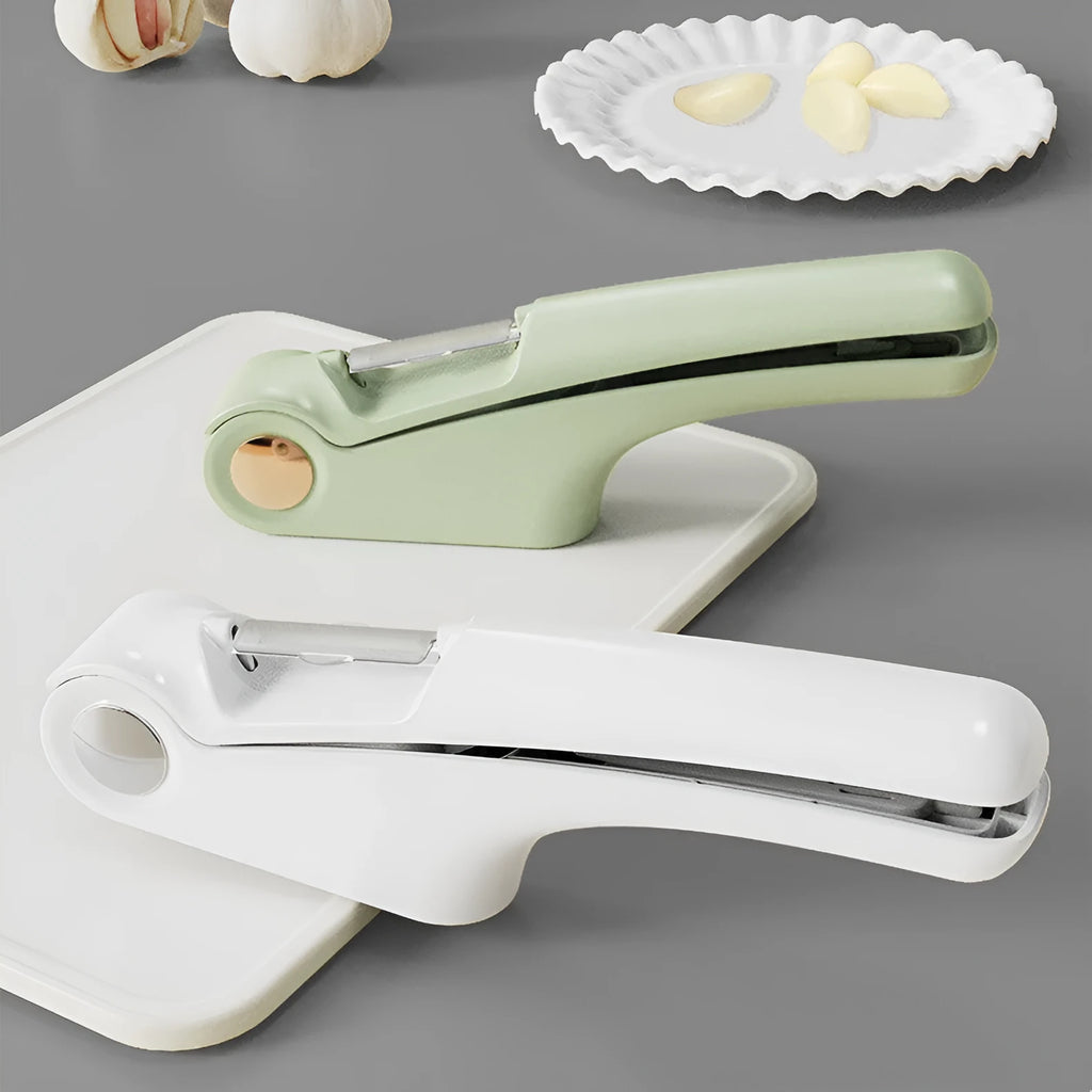 White manual garlic press made of ABS plastic and stainless steel on a kitchen counter.