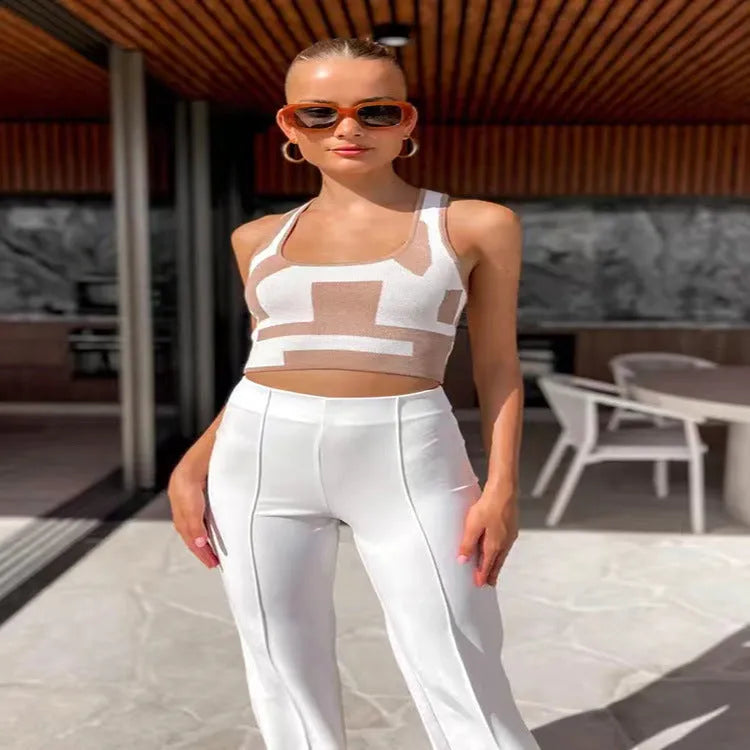 Women's slim fit U-neck camisole top in a street fashion style with an exposed navel design.
