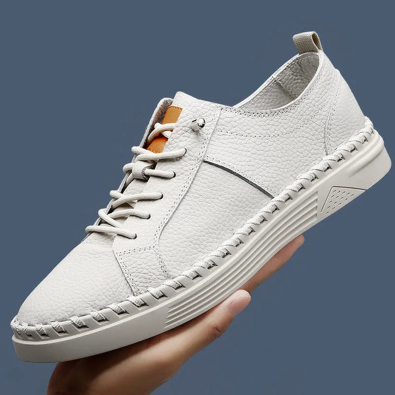 Men's beige sneakers made from first layer cowhide with mesh lining and round toe.