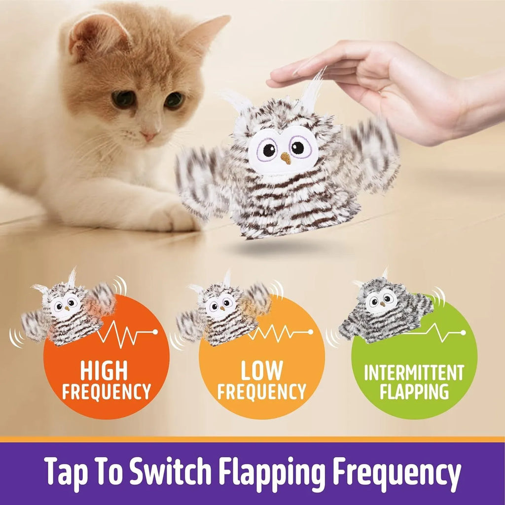 Grey automatic chirping owl cat toy with flapping wings on flat surface