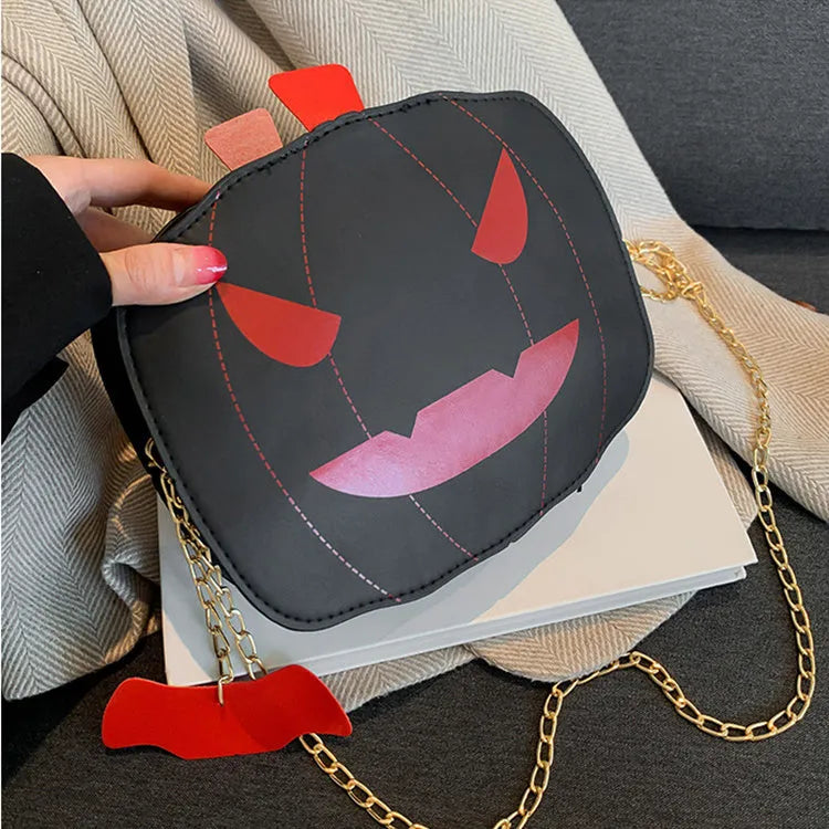Halloween cartoon pumpkin shoulder bag for girls in colour options with chain crossbody strap on white background