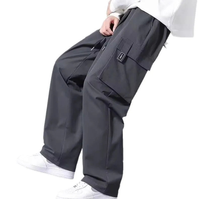 Boys' straight-leg cargo pants in army green with large pockets and a drawstring waistband.