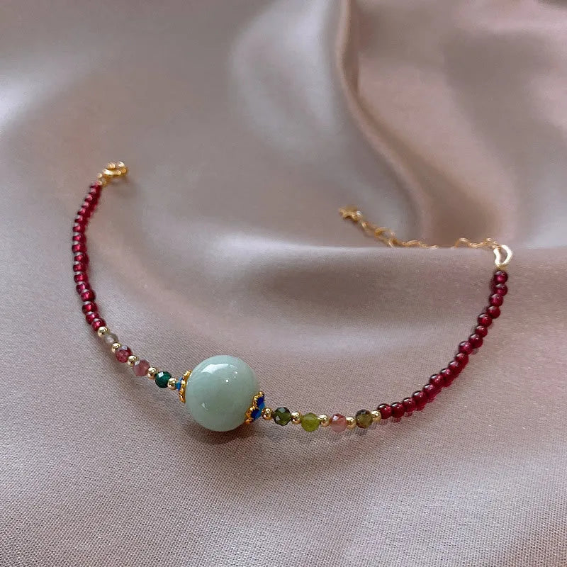 Women's aquamarine and garnet bracelet with drop shape stones and electroplated tourmaline elements
