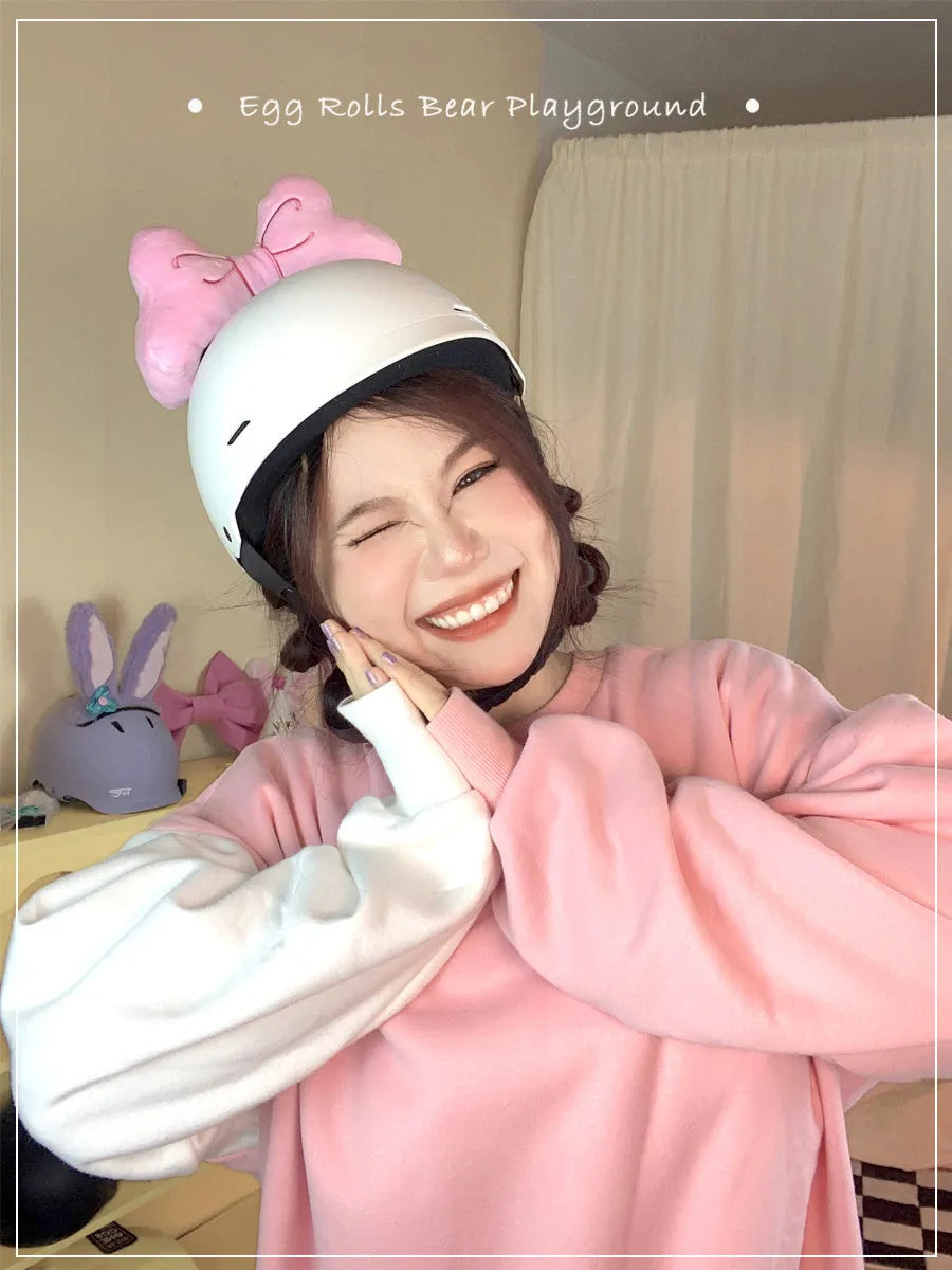 Soft plush bow helmet decoration in red, pink, or rose pink for motorcycle or ski helmet customisation.