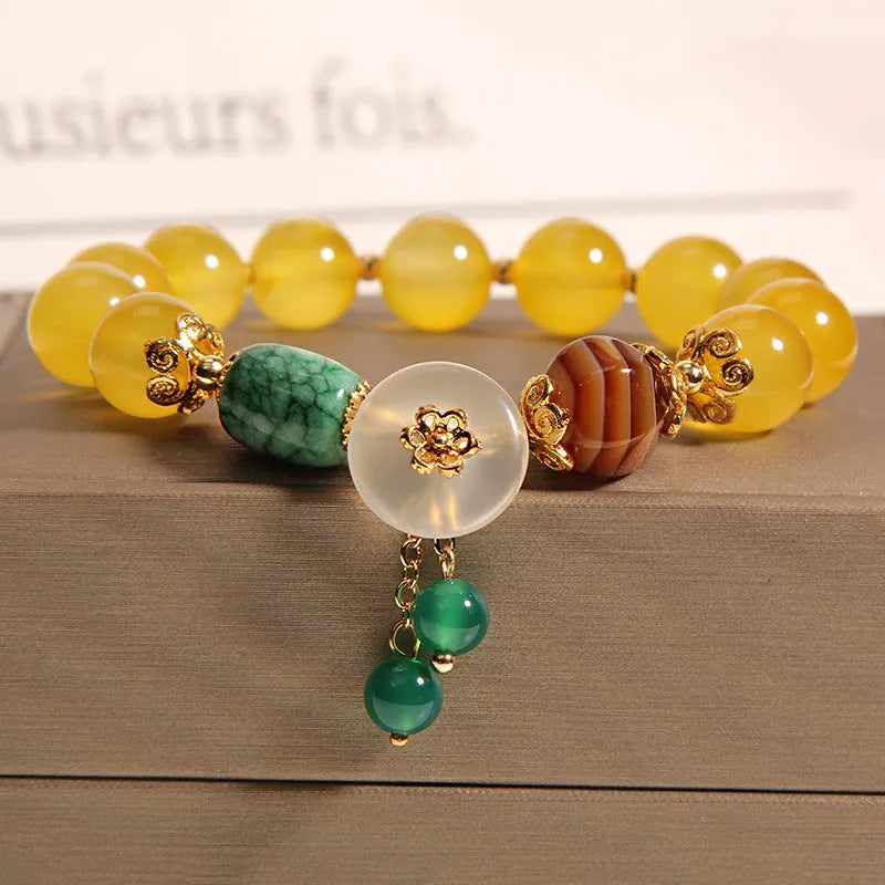 Yellow agate crystal bracelet on a gold silk cord, showing khaki colour and Japanese-Korean style.