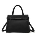 Genuine leather women's crossbody bag in clamshell design with multiple internal pockets