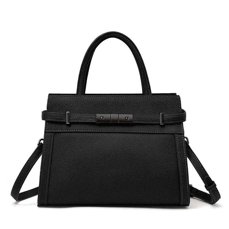 Genuine leather women's crossbody bag in clamshell design with multiple internal pockets