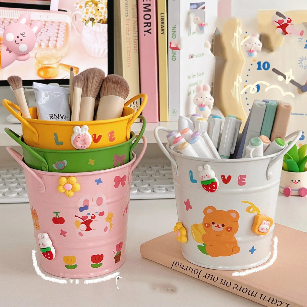 Round metal desktop pen holder in a choice of colours including pink, green, and yellow.