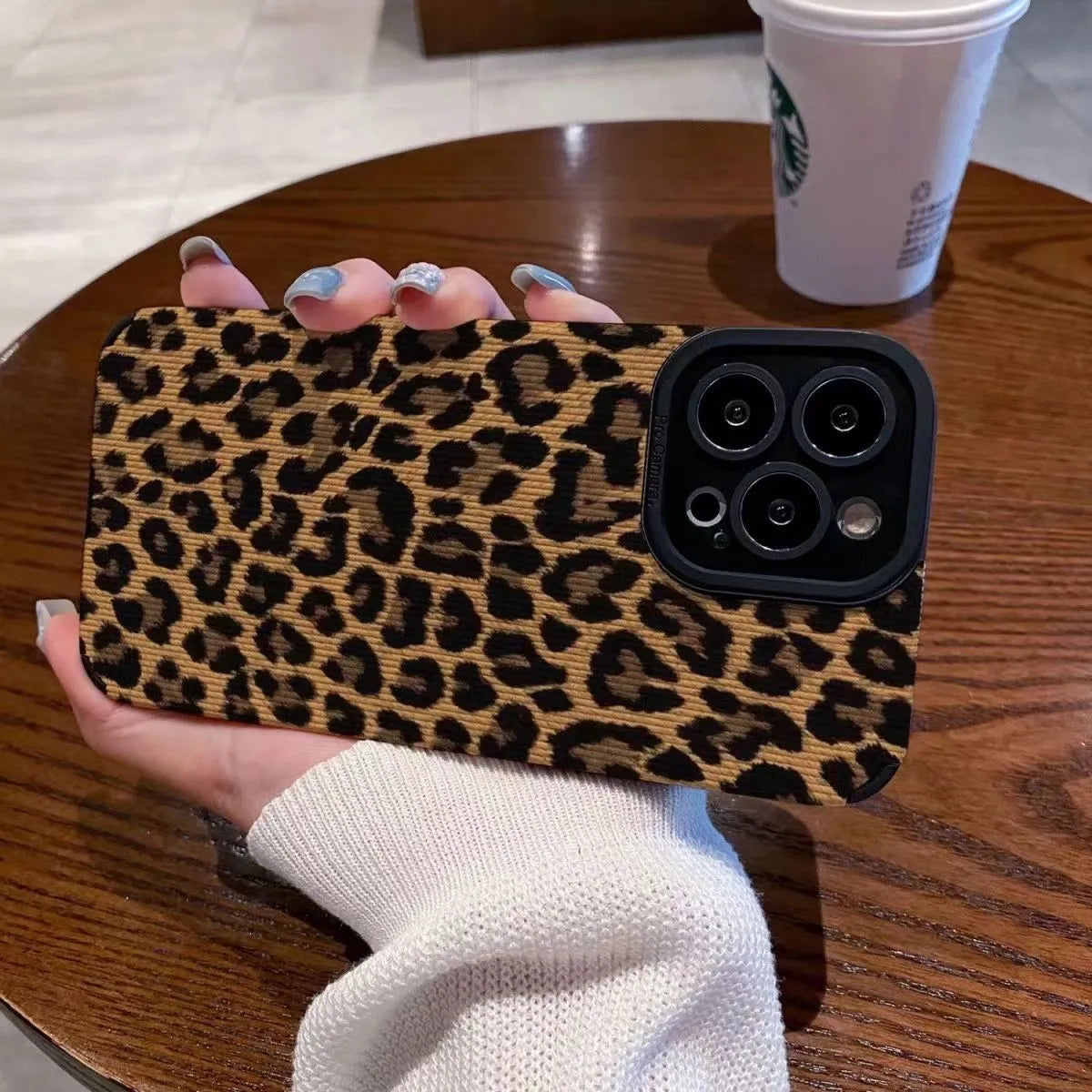 Brown leopard print iPhone 15 phone case with three-dimensional relief and TPU material.