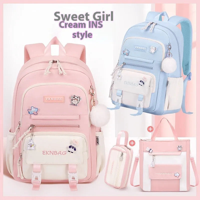 A girls' school backpack in Oxford cloth, featuring curved shoulder straps, shown in a choice of colours including pink, blue, and black.