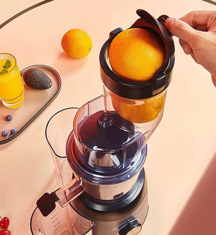 Grey slow masticating juicer with 90mm feed chute and multi-function separator on countertop