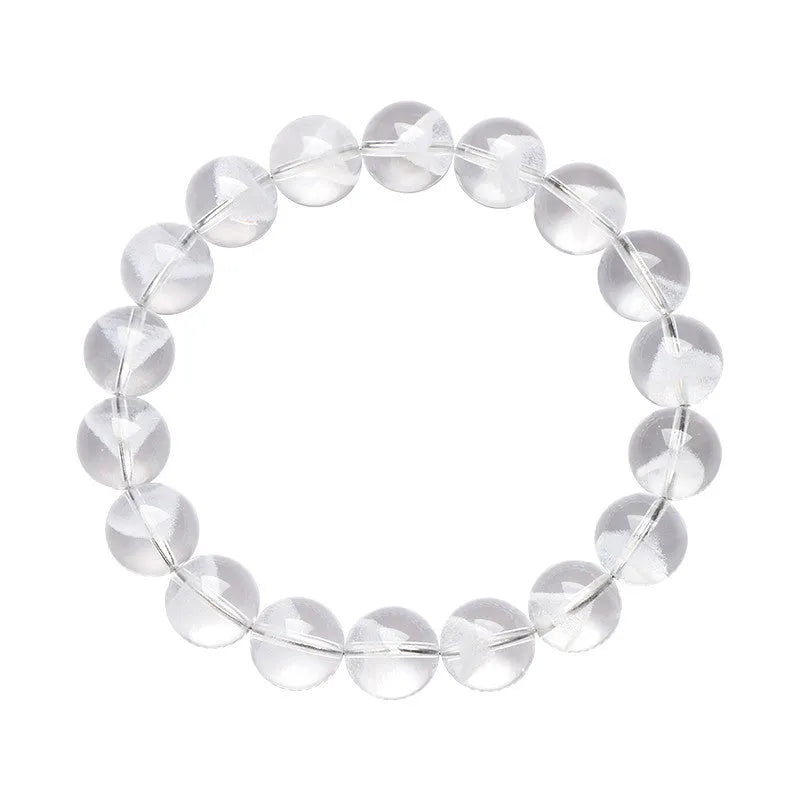 Women's natural white crystal bracelet with a pyramid charm and ruyi charm, showing spherical beads.