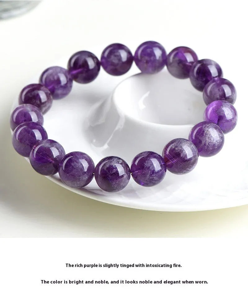 Feather amethyst crystal bracelet in Snow Mountain purple with scattered Ruyi geometry beads.