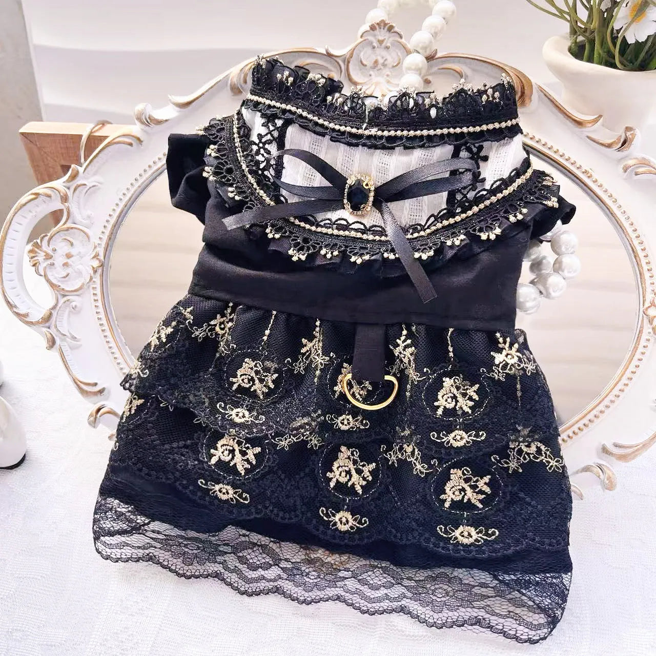 Golden gothic-style skirt costume on a small dog, showing the full princess silhouette and detailed sizing.