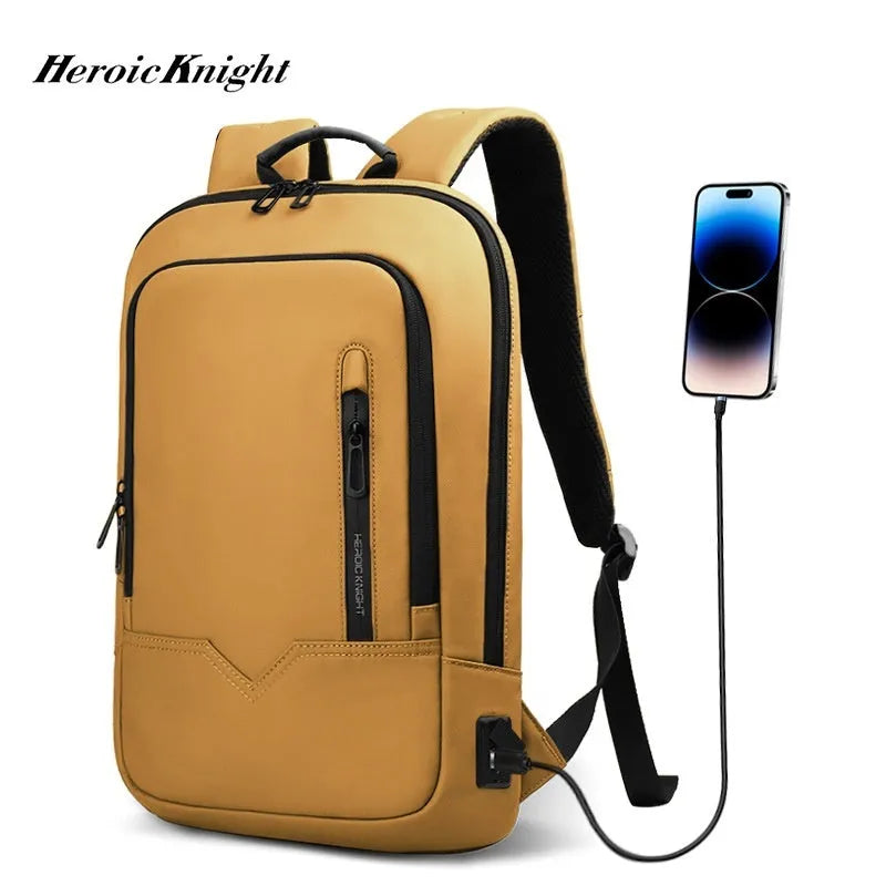 Lightweight solid-colour polyester laptop backpack showing external USB charging port.