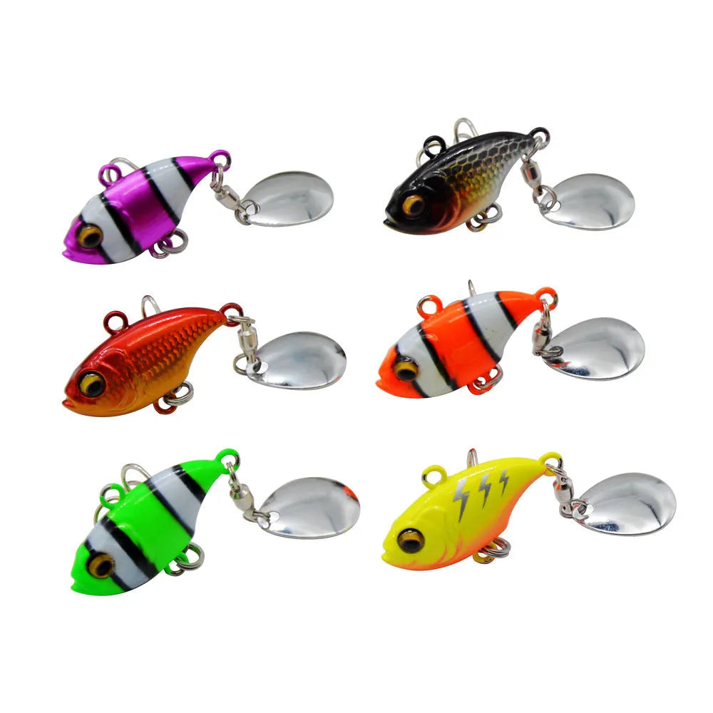 Gold metal fishing spinnerbait lure with a rotating sequin plate on a hook.