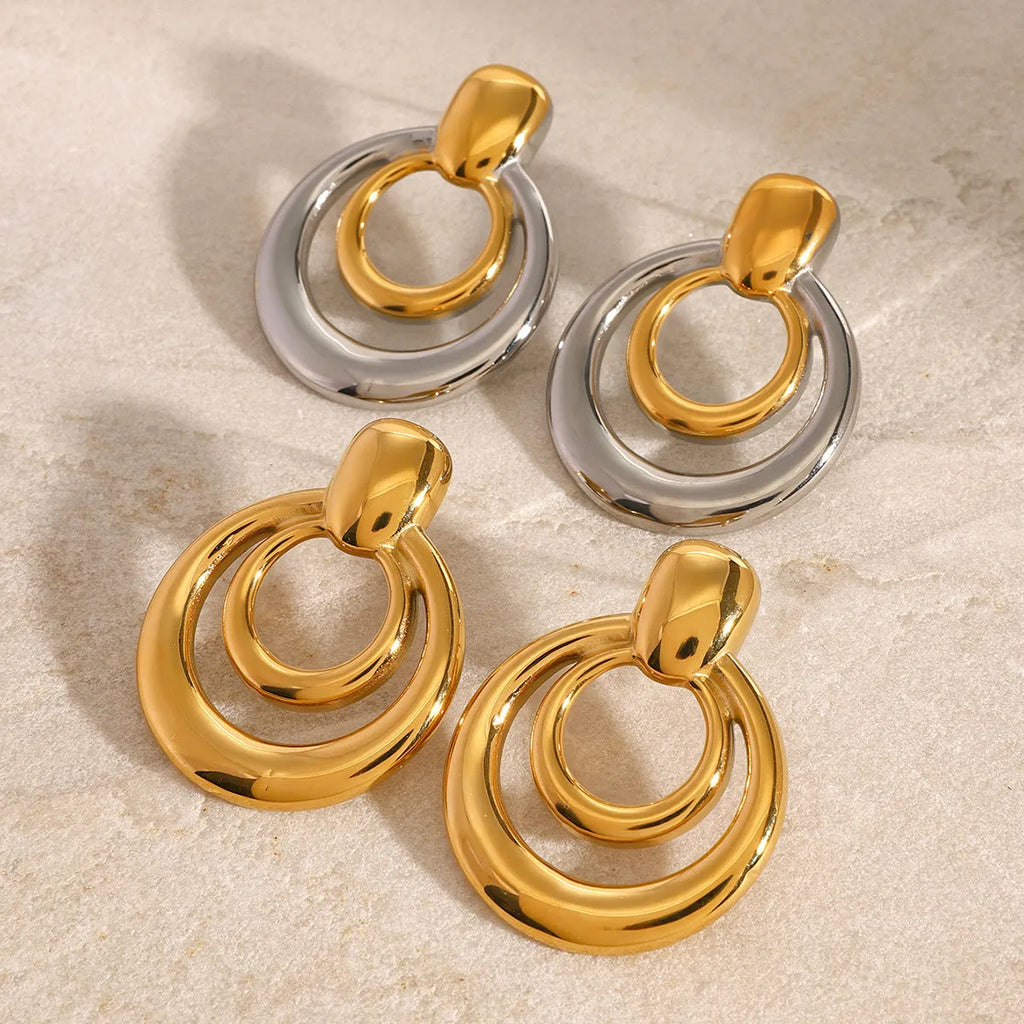Golden titanium steel round stud earrings with double-layer hollow geometric design