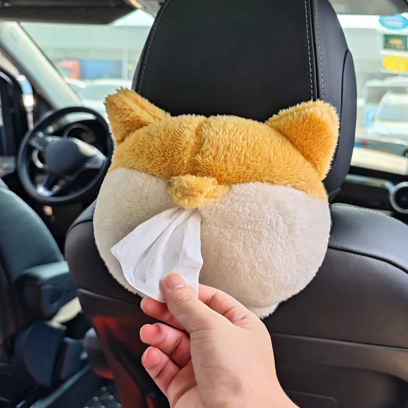 Yellow soft plush corgi butt-shaped tissue box cover with elastic back for car visor.
