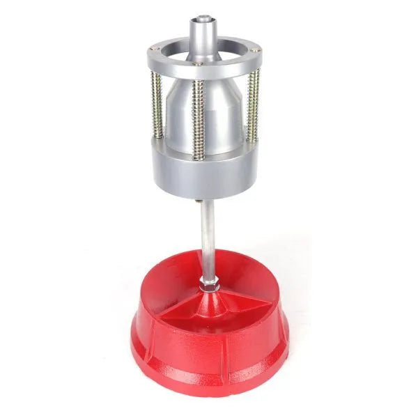 Portable wheel hub balancer with aluminium head and bull's eye level on an enamel base.