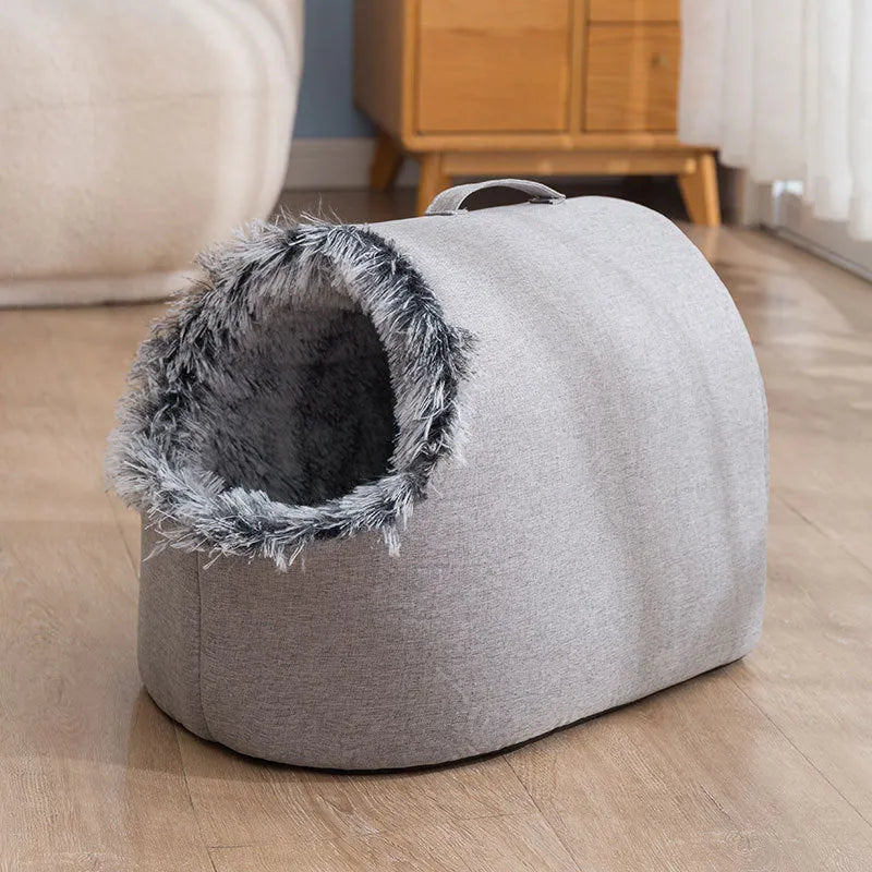 Grey fleece-lined closed cat sleeping bag bed showing enclosed nest design for winter warmth.