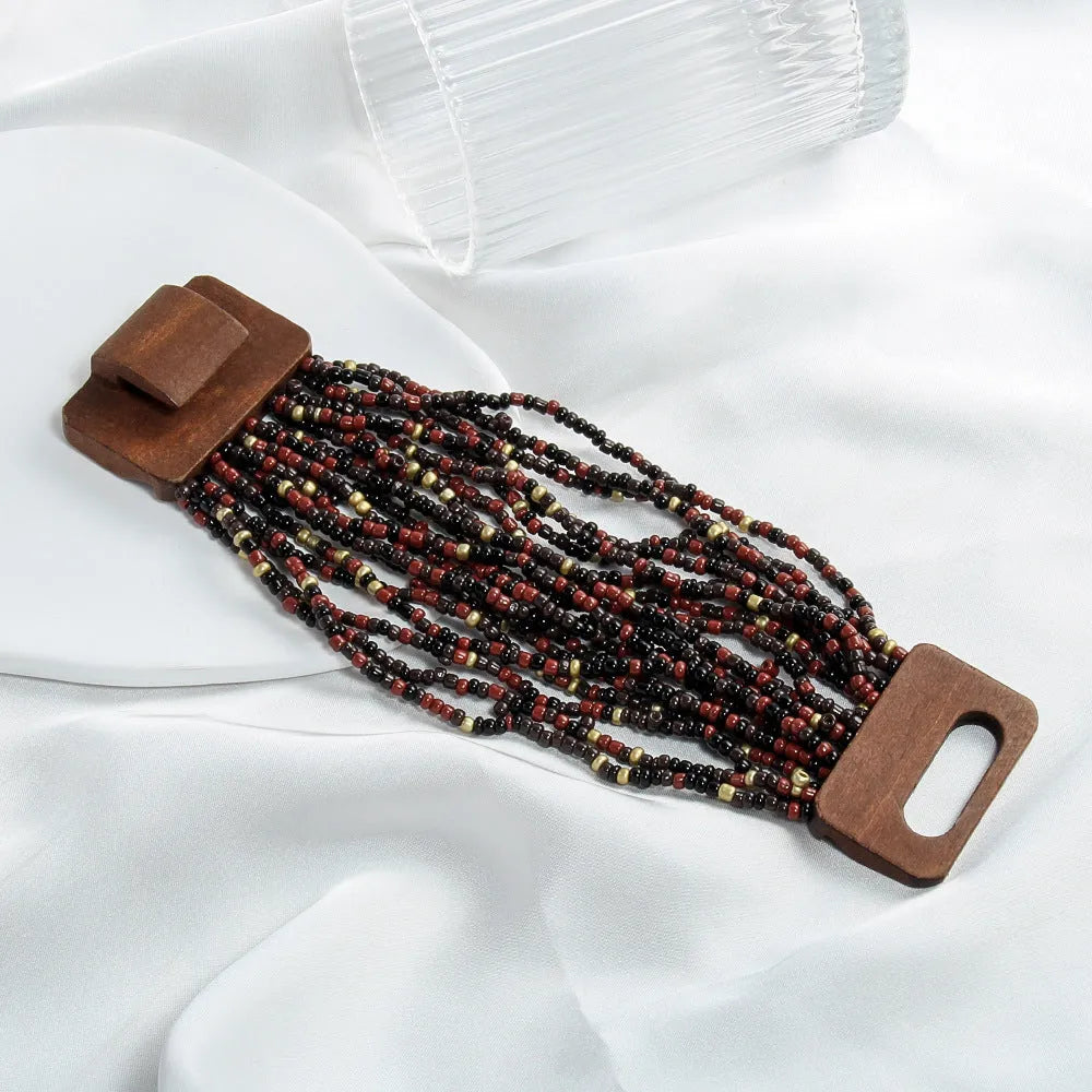 Handmade multi-layer elastic bracelet with rice-shaped glass and coloured glaze beads in geometric quadrilateral pattern, six colour options