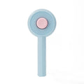 Blue self-cleaning pet grooming brush with angled metal needles for cats and dogs