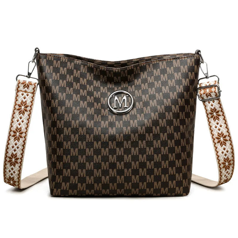 Black retro dumpling-shaped PU leather shoulder bag with an external sandwich pocket.