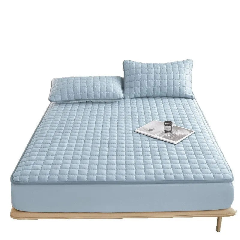 Washed cotton waterproof fitted sheet for beds in blue, shown on a mattress