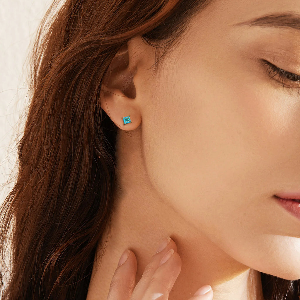 Gold-plated drop earrings with a candy-coloured pear-shaped zircon stone.