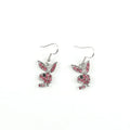 Close-up of a pair of sparkling rabbit silhouette stud earrings with cubic zirconia stones on a silver background.