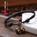 Nylon rope dog collar with brass bell and buckle in black, red, or coffee colour on a size chart.