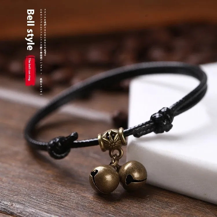 Nylon rope dog collar with brass bell and buckle in black, red, or coffee colour on a size chart.