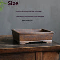 Rectangular purple sand bonsai pot with five-line textured pattern, shown empty on a wooden surface.