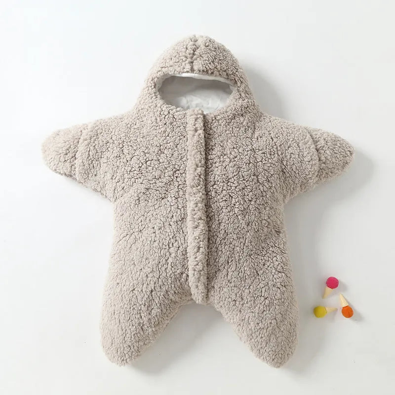 Cashmere and cotton baby sleeping bag with hood, shown in pink, grey, light blue, or khaki.