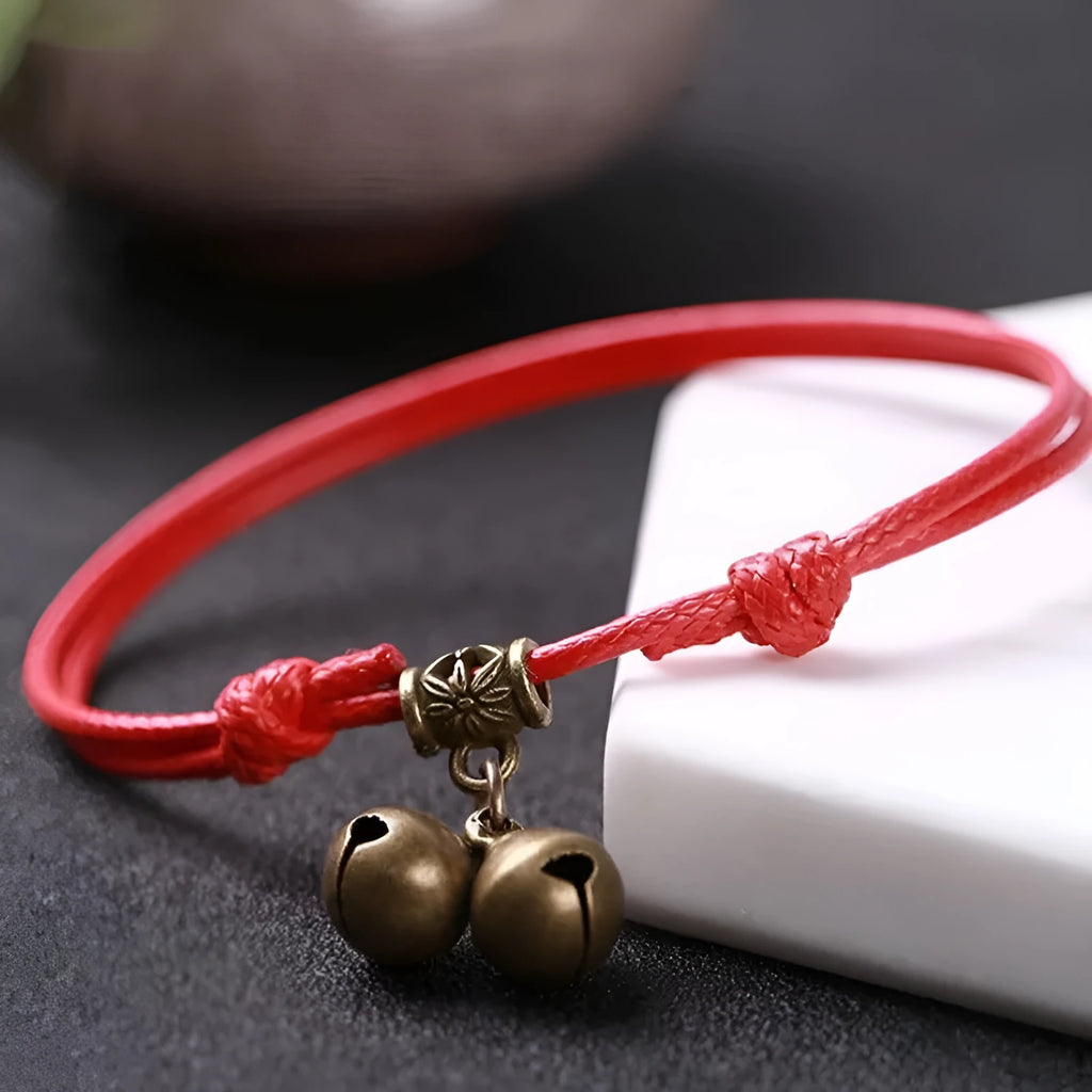 Nylon rope dog collar with brass bell and buckle in black, red, or coffee colour on a size chart.