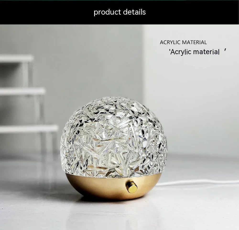 Water ripple projector night light with crystal-like acrylic body and colourful ripple patterns on a bedside table