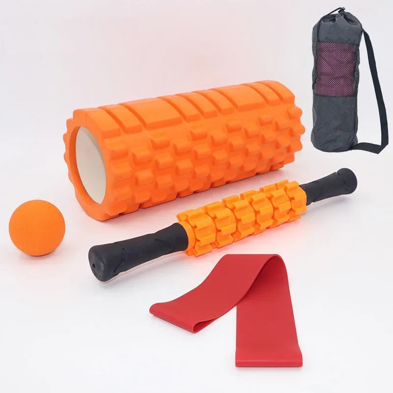 Black 33cm long foam roller massage stick with gear bar design on a grey background.