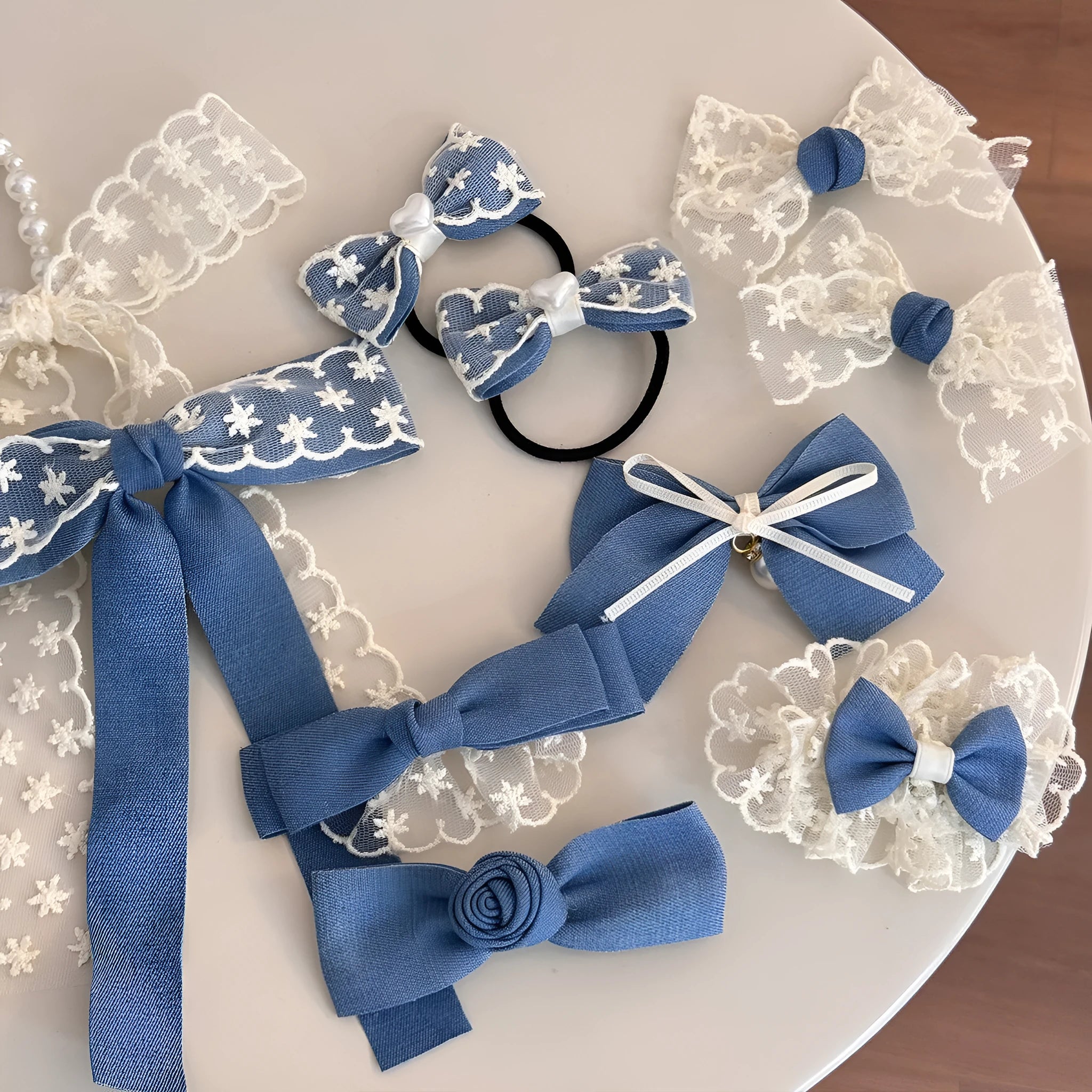 Beige lace hair rope barrette with blue bow decoration and metal clip