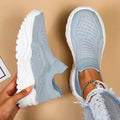 Women's light blue mesh slip-on sports shoes with round toe and mid heel