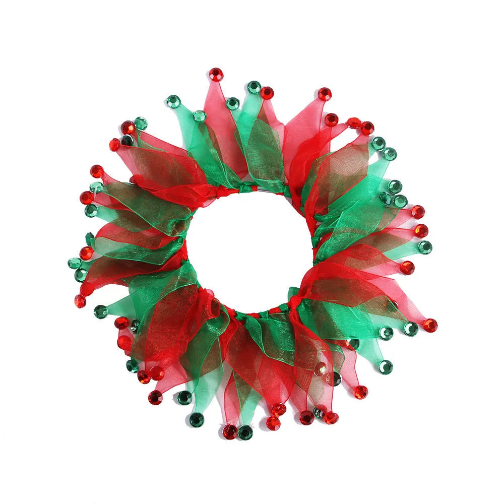 Colourful tie-dye dog collar on a white background showing blue, green, Halloween and Christmas patterns.