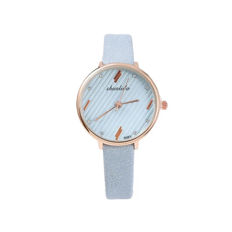 Trendy student watch with round white dial, 32mm diameter, stainless steel buckle on a light background
