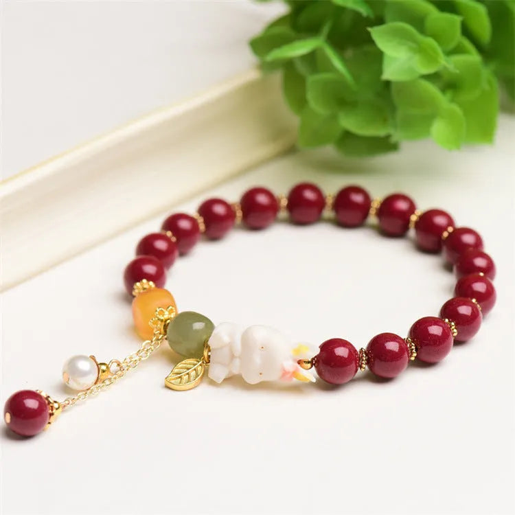 Natural cinnabar bracelet with rabbit design in purple gold sand colour, showing 8mm and 10mm bead size options.
