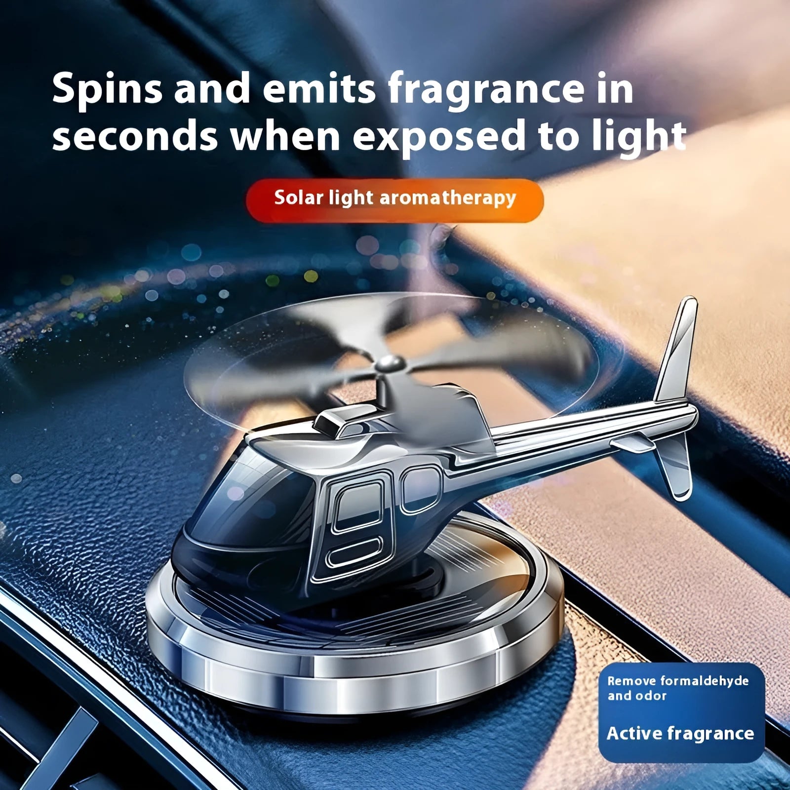Silver metal solar helicopter car perfume ornament with rotating blades on a dashboard.