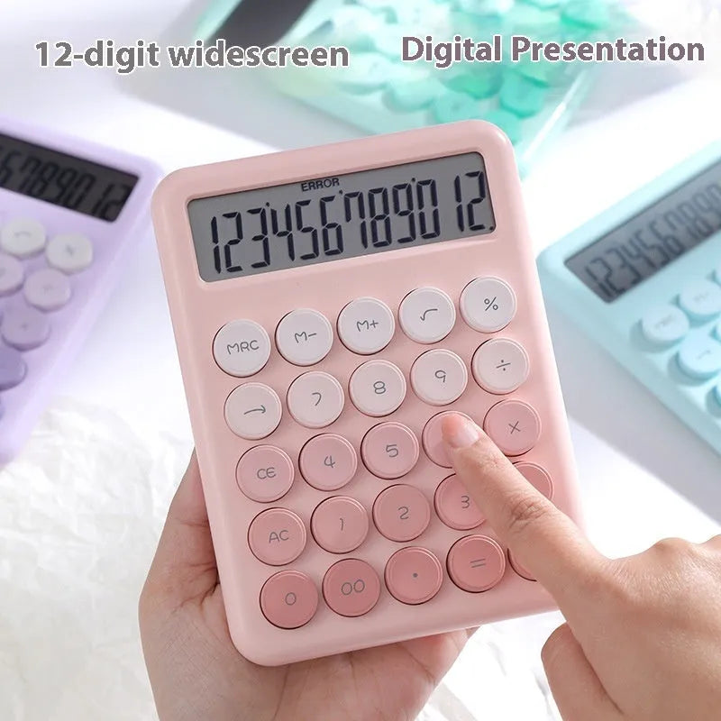 Gradient colour desktop calculator in violet, pink, blue, or green on a desk.