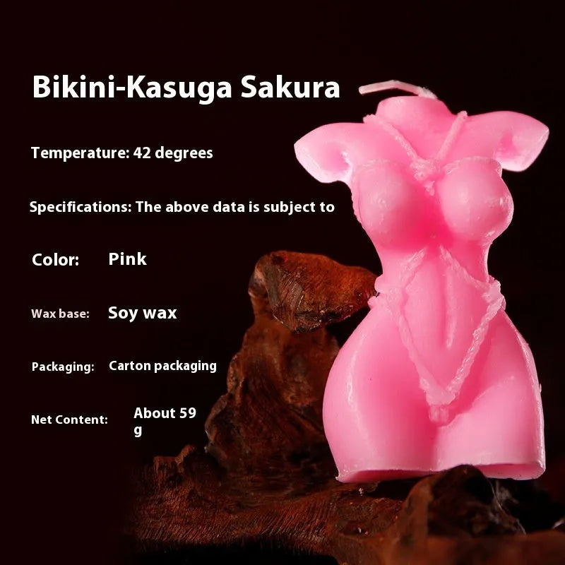 Soy wax low temperature novelty candle in a bikini shape, shown in rose red, spring pink, and lilac purple colours.