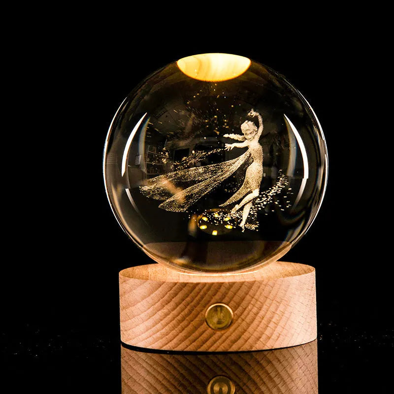 Transparent crystal ball with 3D laser inner carving galaxy design on a beech wood touch light base, warm light glowing