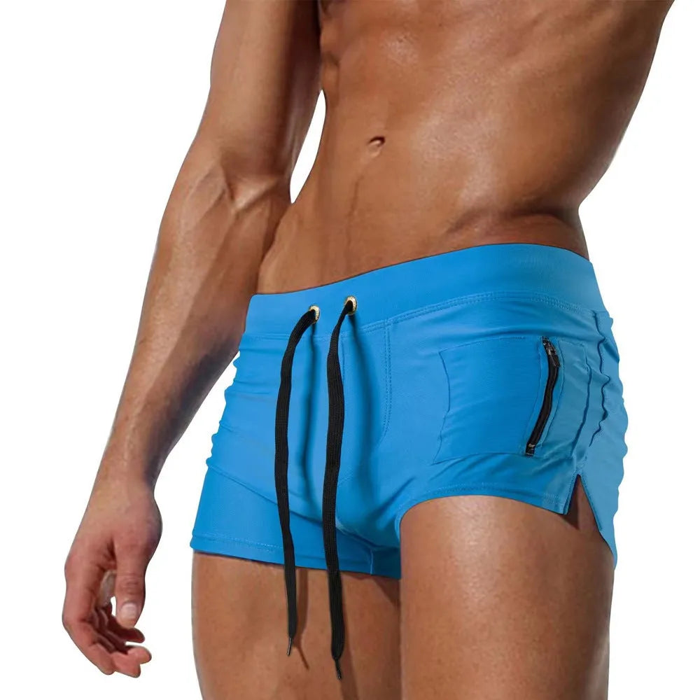 Men's solid colour high waist swimming trunks with a lace-up front closure, shown in black.