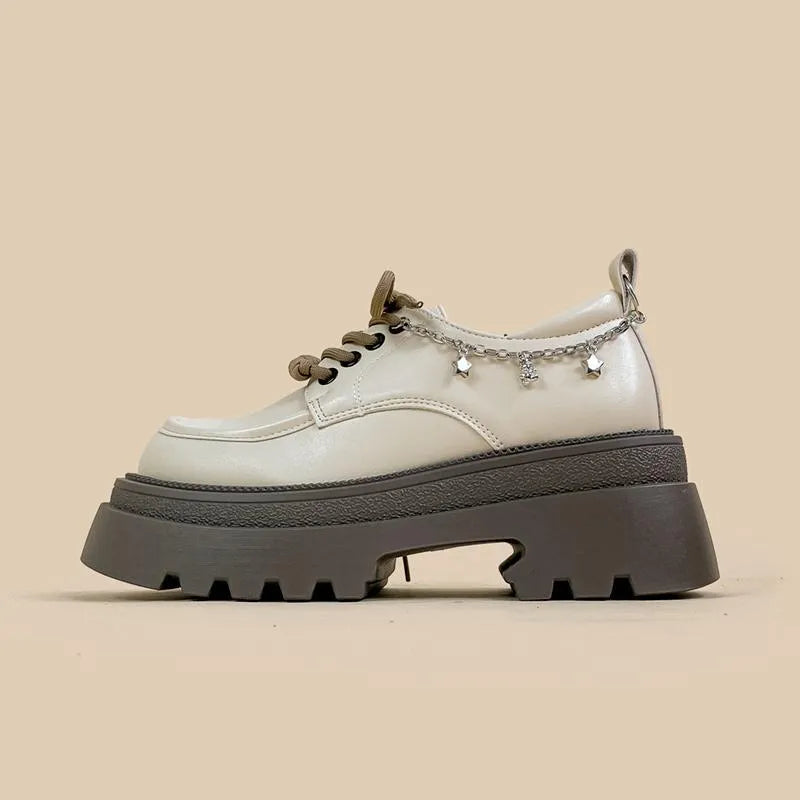 White women's Mary Jane platform shoes with chunky heel and front lace-up.